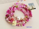 Pink bracelet with elephant and flowers pendants