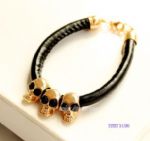 Leather bracelet with skulls decoration
