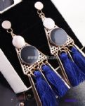 Exaggerated drop earring with tassels