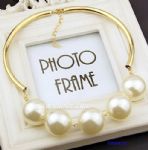 Metal tube with pearls inlaid 