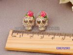 Skull stud earrings decorated with stones and enameled
