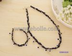 Braided necklace drop with metal flower