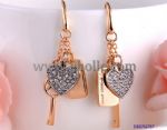 Gold plating earring decorated with key and lock 
